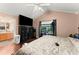 Bedroom featuring built-in storage and an en-suite bathroom at 8436 Cyprus Ridge Way, Douglasville, GA 30134