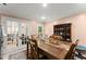 Traditional dining room featuring hardwood flooring and ornate glass door that leads to the living room at 8436 Cyprus Ridge Way, Douglasville, GA 30134