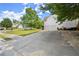Long driveway leading to a well-maintained two-story home with a two-car garage at 8436 Cyprus Ridge Way, Douglasville, GA 30134