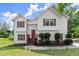 Charming two-story home with red shutters and a well-maintained front lawn at 8436 Cyprus Ridge Way, Douglasville, GA 30134