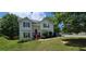 Traditional home with well-manicured lawn and mature shade trees at 8436 Cyprus Ridge Way, Douglasville, GA 30134