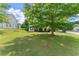 Beautiful home featuring a well-maintained lawn and mature trees at 8436 Cyprus Ridge Way, Douglasville, GA 30134