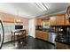 Eat-in kitchen boasting stainless steel appliances, dark countertops and floors at 8436 Cyprus Ridge Way, Douglasville, GA 30134