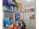 Functional laundry room with metal storage shelves and laundry machines at 8436 Cyprus Ridge Way, Douglasville, GA 30134