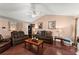 Inviting living room featuring wood floors, comfortable seating, and ample natural light at 8436 Cyprus Ridge Way, Douglasville, GA 30134