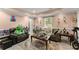 Cozy living room offering lots of light, comfortable seating, and recessed lighting at 8436 Cyprus Ridge Way, Douglasville, GA 30134