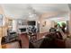 Bright and spacious living room featuring wood floors, a fireplace, and an open floor plan at 8436 Cyprus Ridge Way, Douglasville, GA 30134