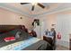 Main bedroom with ceiling fan and a comfy queen-size bed at 8436 Cyprus Ridge Way, Douglasville, GA 30134
