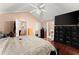 Spacious main bedroom featuring hardwood floors, a ceiling fan, and ample closet space at 8436 Cyprus Ridge Way, Douglasville, GA 30134