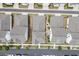 Aerial view of homes showcasing a modern neighborhood layout with paved walkways, driveways, and professional landscaping at 1023 Harvest Park Ln, Suwanee, GA 30024