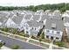 Aerial view showcasing the home's position within a well-maintained neighborhood and landscaping at 1023 Harvest Park Ln, Suwanee, GA 30024