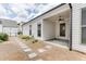 A view of the backyard with stepping stones leading to a covered patio and fenced-in yard at 1023 Harvest Park Ln, Suwanee, GA 30024