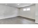 Bedroom with hardwood floors, white walls, and window looking out to backyard at 1023 Harvest Park Ln, Suwanee, GA 30024