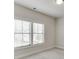Bedroom featuring two windows that offer natural light and carpet at 1023 Harvest Park Ln, Suwanee, GA 30024