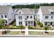 Beautiful two-story white home with manicured landscaping, covered entryway, and attractive curb appeal at 1023 Harvest Park Ln, Suwanee, GA 30024