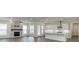 Living room showcases a brick fireplace, hardwood floors, recessed lights and open access to kitchen at 1023 Harvest Park Ln, Suwanee, GA 30024