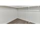 Empty walk-in closet featuring hardwood floors, offering a blank canvas to create your dream wardrobe space at 1023 Harvest Park Ln, Suwanee, GA 30024