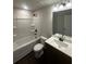 Updated bathroom boasts a tub and shower combination, sleek vanity, and modern fixtures at 1151 Park Center Cir, Austell, GA 30168