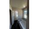 Bathroom featuring a soaking tub with a tiled surround at 1151 Park Center Cir, Austell, GA 30168