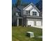 Charming home featuring a two-car garage, brick accents, and well-maintained landscaping at 1151 Park Center Cir, Austell, GA 30168
