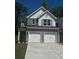 Charming home featuring a two-car garage, brick accents, and well-maintained landscaping at 1151 Park Center Cir, Austell, GA 30168
