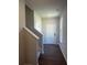 Bright entryway featuring dark wood floors and a white front door at 1151 Park Center Cir, Austell, GA 30168