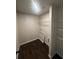 Practical laundry room with shelving and dark, durable flooring for easy maintenance at 1151 Park Center Cir, Austell, GA 30168