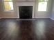 Living room featuring a fireplace and dark wood floors at 1151 Park Center Cir, Austell, GA 30168