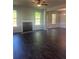Spacious living room featuring dark floors, a fireplace, bright windows, and classic trim at 1151 Park Center Cir, Austell, GA 30168