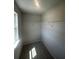 Bright walk-in closet featuring wire shelving and a window for added convenience at 1151 Park Center Cir, Austell, GA 30168