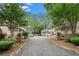 Community entrance with landscaped grounds and visitor parking at 1990 Wellbourne Drive Northeast #7 Ne Dr # 7, Atlanta, GA 30324