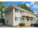 Exterior view of two-story apartment building with small patios and white brick at 1990 Wellbourne Drive Northeast #7 Ne Dr # 7, Atlanta, GA 30324