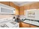 Updated kitchen features granite countertops, a gas stove, and stainless steel appliances at 1990 Wellbourne Drive Northeast #7 Ne Dr # 7, Atlanta, GA 30324
