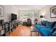 Inviting living room features hardwood floors, a blue sofa, and built-in bookcase for display at 1990 Wellbourne Drive Northeast #7 Ne Dr # 7, Atlanta, GA 30324