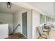 Front porch with seating area, table and green door at 1990 Wellbourne Drive Northeast #7 Ne Dr # 7, Atlanta, GA 30324