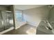 This bathroom includes a walk-in shower, a soaking tub, a double vanity and a window at 265 Sanctuary Dr, Lawrenceville, GA 30046