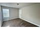 Bedroom featuring carpeted floors, base trim and a window with blinds at 265 Sanctuary Dr, Lawrenceville, GA 30046