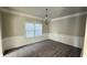 Bright dining room featuring carpet floors, wainscoting and a chandelier at 265 Sanctuary Dr, Lawrenceville, GA 30046