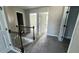 Upstairs hallway features modern railing and plush carpet at 265 Sanctuary Dr, Lawrenceville, GA 30046
