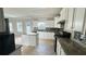 Bright kitchen features white cabinetry, granite countertops, and stainless steel appliances at 265 Sanctuary Dr, Lawrenceville, GA 30046