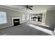Spacious living room open to kitchen area with lots of natural light from the windows at 265 Sanctuary Dr, Lawrenceville, GA 30046