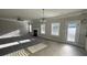 Living room with a fireplace, carpet and tile flooring, and natural light at 265 Sanctuary Dr, Lawrenceville, GA 30046