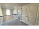 Upstairs hallway features modern lighting, and plush carpet at 265 Sanctuary Dr, Lawrenceville, GA 30046