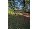 Backyard featuring a beautiful property surrounded by lush greenery and trees at 2661 Throatlatch Sw Ln, Marietta, GA 30064