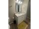 Updated bathroom with granite countertop vanity and modern fixtures at 2661 Throatlatch Sw Ln, Marietta, GA 30064