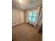 Bedroom with carpeting and a window letting in lots of natural light at 2661 Throatlatch Sw Ln, Marietta, GA 30064