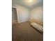 Cozy bedroom with soft carpeting and a small crib, perfect for a Bedroom at 2661 Throatlatch Sw Ln, Marietta, GA 30064