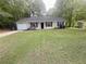 Charming single story home with a well maintained lawn and attached garage at 2661 Throatlatch Sw Ln, Marietta, GA 30064