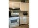 Bright kitchen featuring white cabinets, stainless steel appliances, and light countertops at 2661 Throatlatch Sw Ln, Marietta, GA 30064