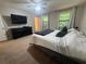 Comfortable main bedroom featuring a ceiling fan, and a large window for natural light at 2661 Throatlatch Sw Ln, Marietta, GA 30064